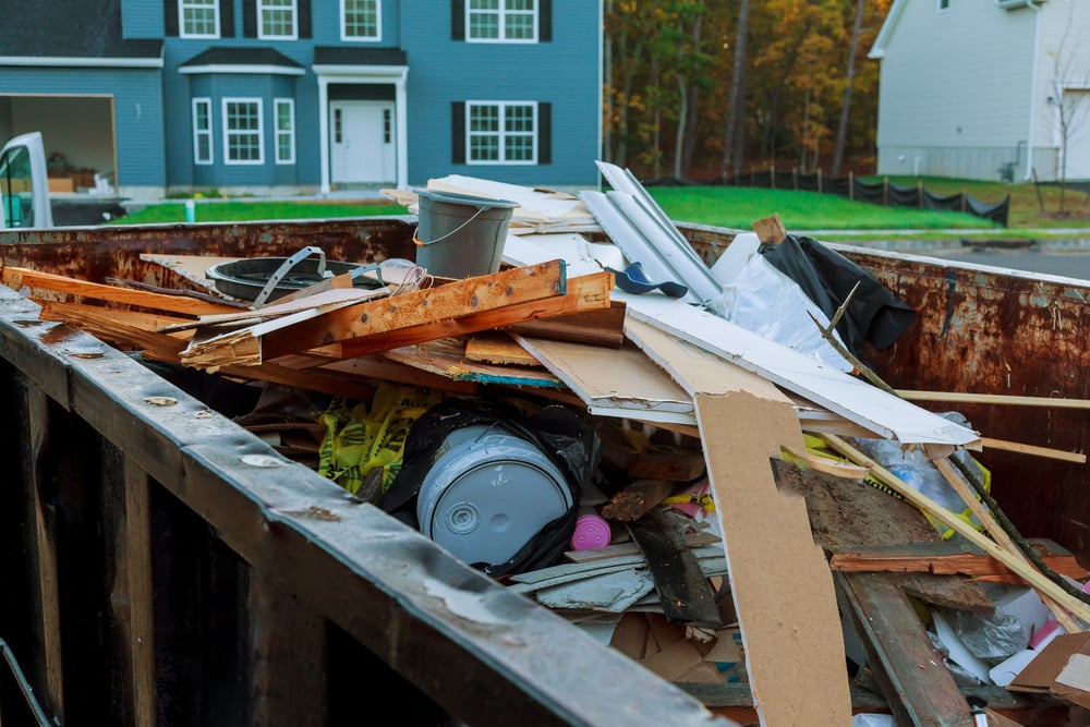 roll-off dumpster filled with building rubble